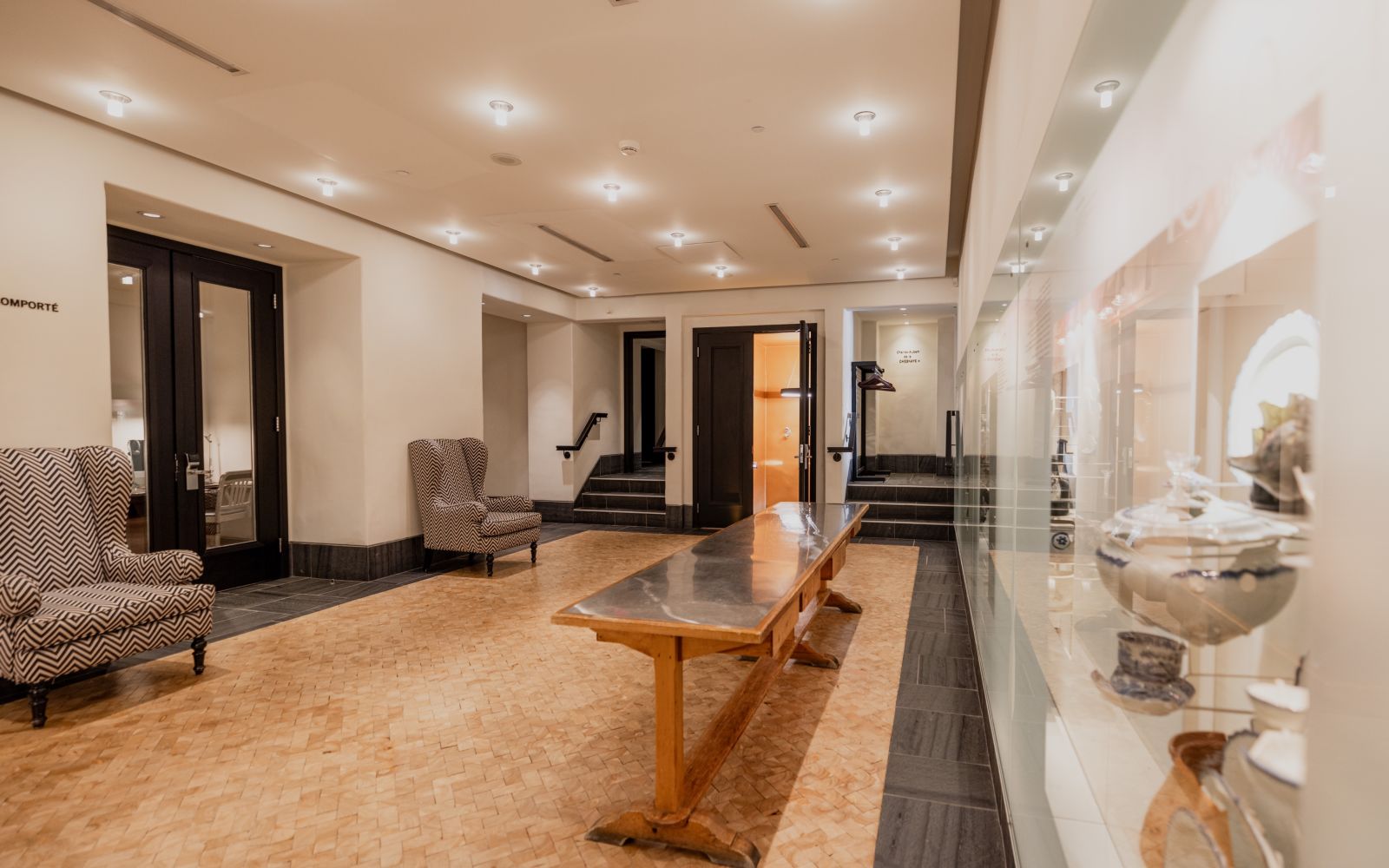 A Large Room With A Table And Chairs