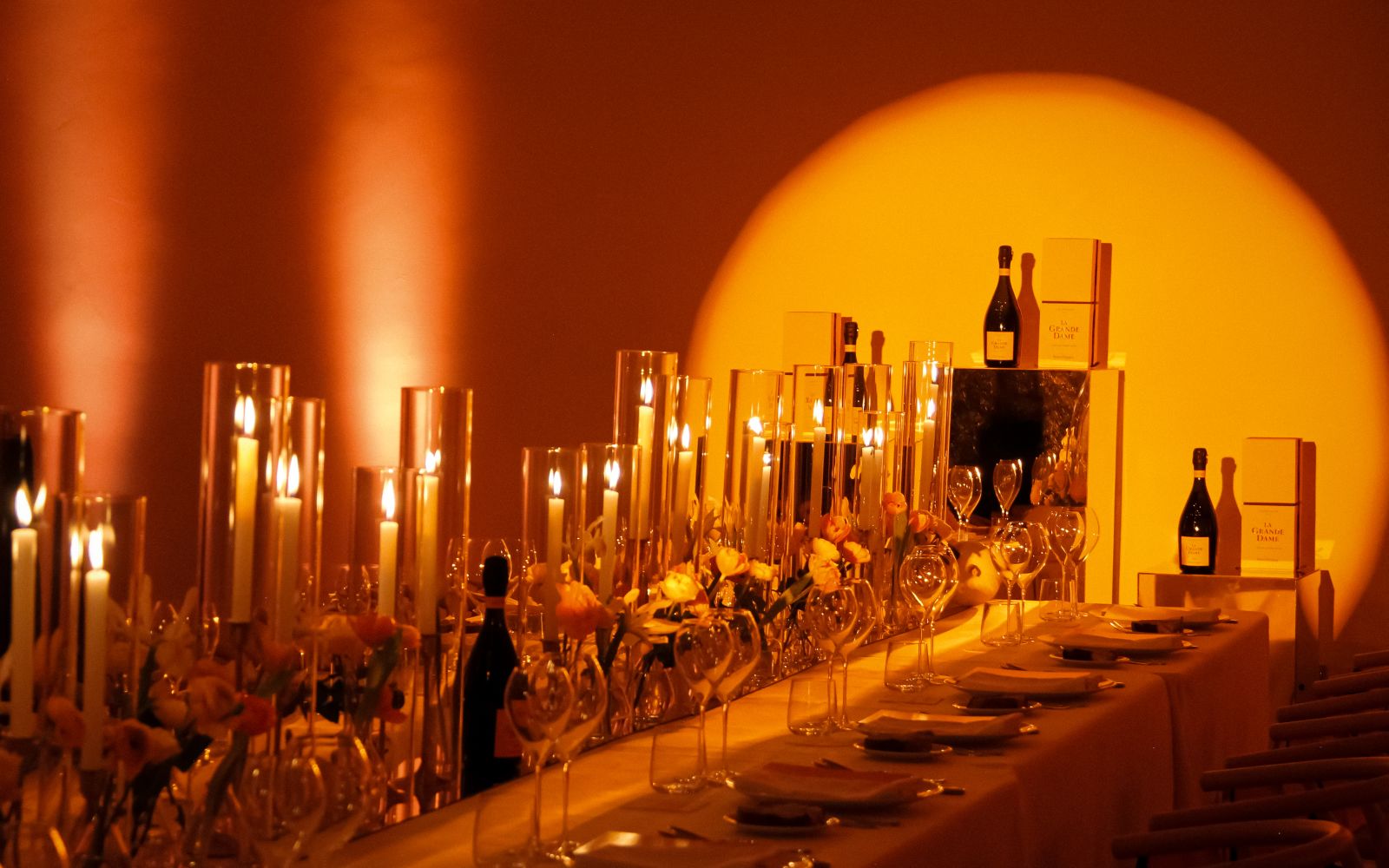 A Table With Wine Bottles And Glasses