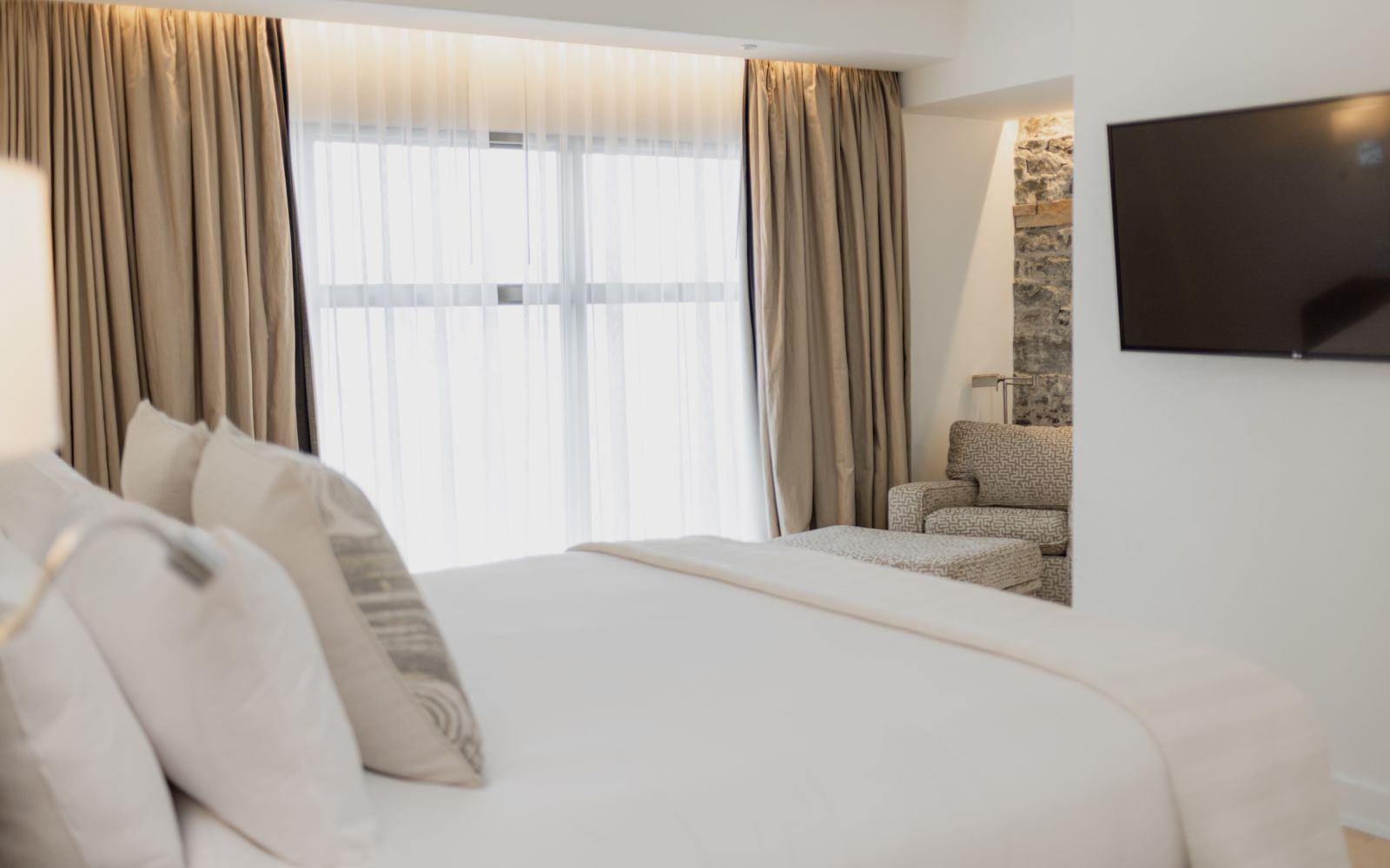 A Bed With White Sheets