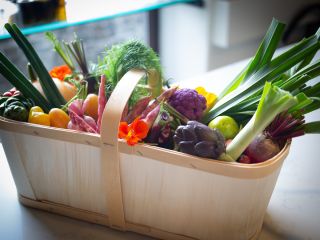 A Bowl Of Fresh Vegetables On A Counter